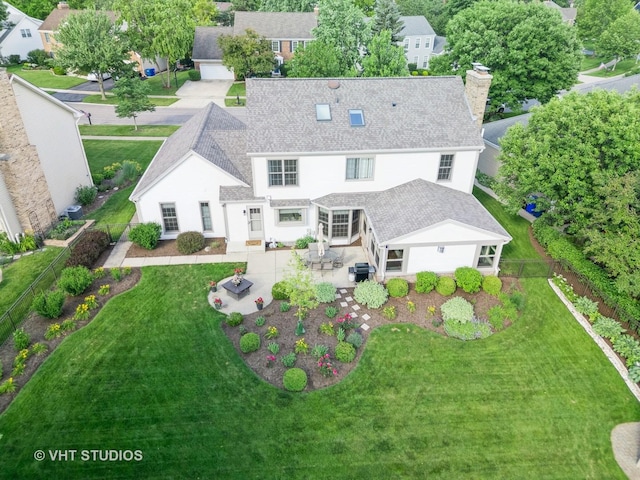 33 Citation Cir, Wheaton, IL 60189 - back of house with a patio area, a fenced backyard, a chimney, and a shingled roof