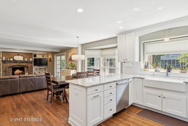 33 Citation Cir, Wheaton, IL 60189 - kitchen with stainless steel dishwasher, white cabinets, light stone counters, dark wood-type flooring, and a peninsula