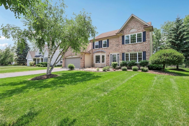7004 Bennington Dr, Gurnee, IL 60031 - colonial-style house with a garage, a front lawn, and concrete driveway