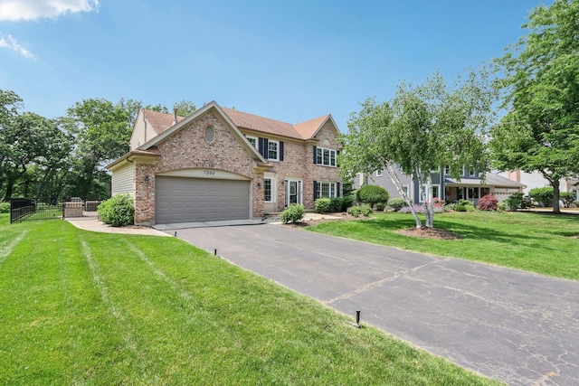 7004 Bennington Dr, Gurnee, IL 60031 - view of front of property with asphalt driveway, a garage, and brick siding