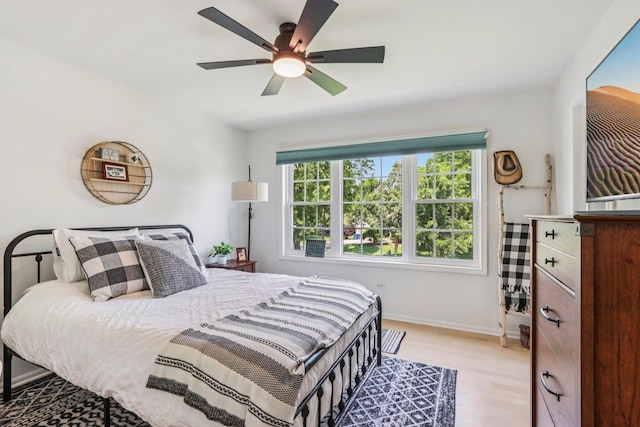 7004 Bennington Dr, Gurnee, IL 60031 - bedroom with light wood-type flooring and ceiling fan