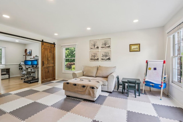 7004 Bennington Dr, Gurnee, IL 60031 - living room with healthy amount of natural light, a barn door, recessed lighting, and an office area