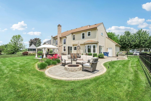7004 Bennington Dr, Gurnee, IL 60031 - rear view of house with a gazebo, a patio area, a chimney, and an outdoor living space with a fire pit