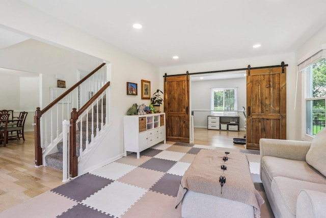 7004 Bennington Dr, Gurnee, IL 60031 - living room featuring a barn door, recessed lighting, stairway, and light wood-type flooring