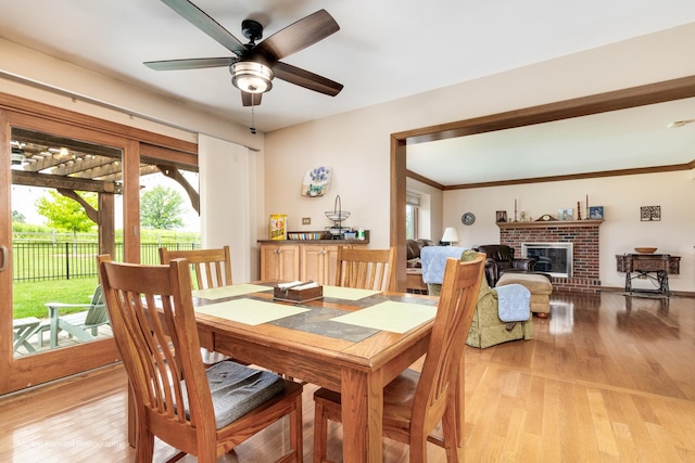 420 Fairway View Dr, Algonquin, IL 60102 - dining space with light wood finished floors, a fireplace, and ceiling fan