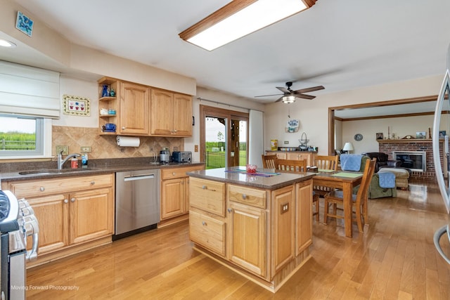 420 Fairway View Dr, Algonquin, IL 60102 - kitchen featuring stainless steel appliances, healthy amount of natural light, light wood-style flooring, and a brick fireplace
