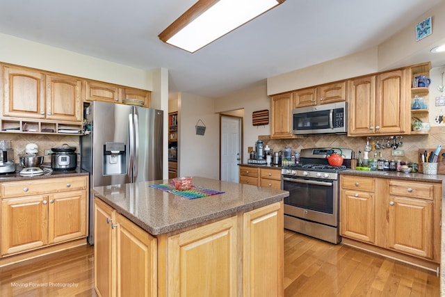 420 Fairway View Dr, Algonquin, IL 60102 - kitchen featuring stainless steel appliances, open shelves, light wood-style flooring, backsplash, and a center island