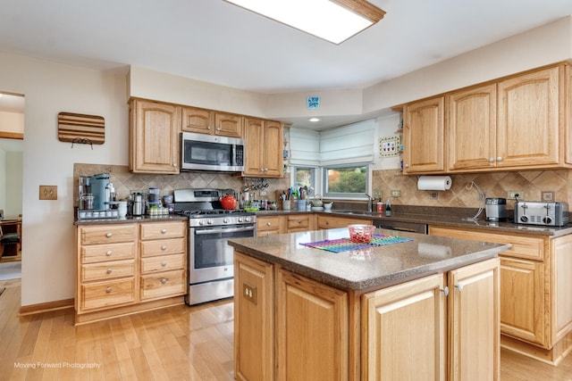 420 Fairway View Dr, Algonquin, IL 60102 - kitchen with appliances with stainless steel finishes, light wood-style flooring, and backsplash