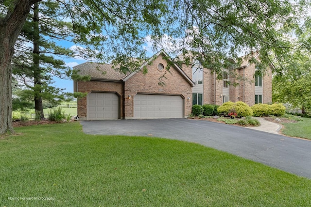 420 Fairway View Dr, Algonquin, IL 60102 - view of front facade featuring asphalt driveway, an attached garage, a front lawn, and brick siding