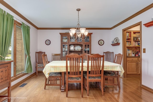 420 Fairway View Dr, Algonquin, IL 60102 - dining area featuring a chandelier, light wood-style flooring, and ornamental molding
