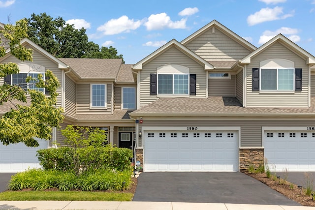 1580 Wind Energy Pass, Batavia, IL 60510 - view of property with driveway, roof with shingles, a garage, and stone siding