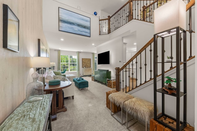 1580 Wind Energy Pass, Batavia, IL 60510 - carpeted living room featuring a high ceiling, stairs, a fireplace, and recessed lighting