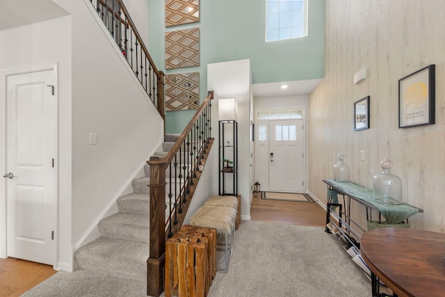 1580 Wind Energy Pass, Batavia, IL 60510 - carpeted entrance foyer featuring a towering ceiling, stairs, and wood finished floors