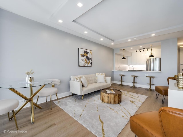 1560 N Sandburg Ter Unit 2403J, Chicago, IL 60610 - living area featuring recessed lighting, light wood-style flooring, and a tray ceiling