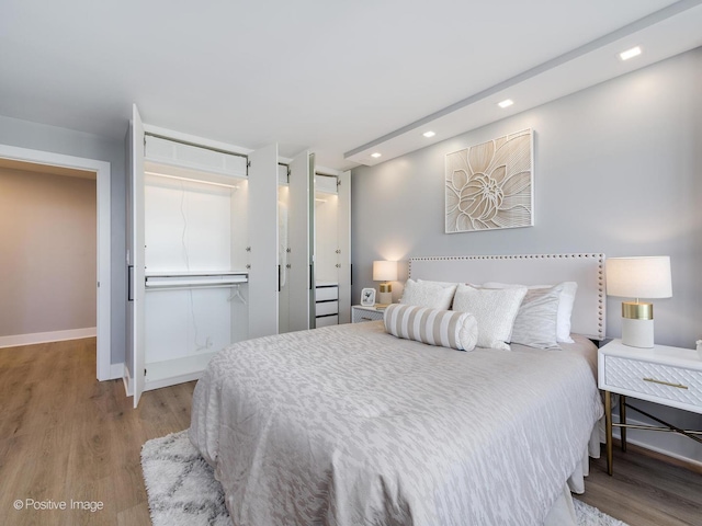 1560 N Sandburg Ter Unit 2403J, Chicago, IL 60610 - bedroom featuring a closet, wood finished floors, and recessed lighting
