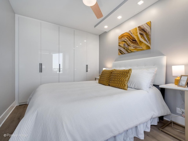 1560 N Sandburg Ter Unit 2403J, Chicago, IL 60610 - bedroom featuring wood finished floors, a closet, recessed lighting, and a ceiling fan