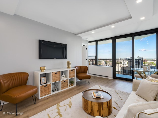 1560 N Sandburg Ter Unit 2403J, Chicago, IL 60610 - living area featuring plenty of natural light, wood finished floors, and recessed lighting
