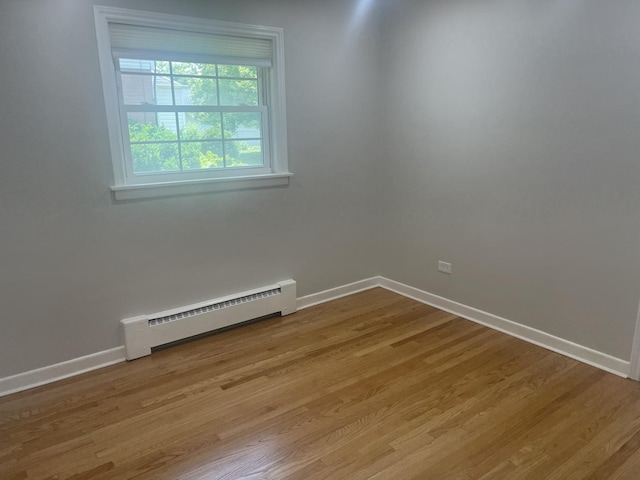 1530 S Greenwood Ave, Park Ridge, IL 60068 - empty room with a baseboard radiator and light wood finished floors