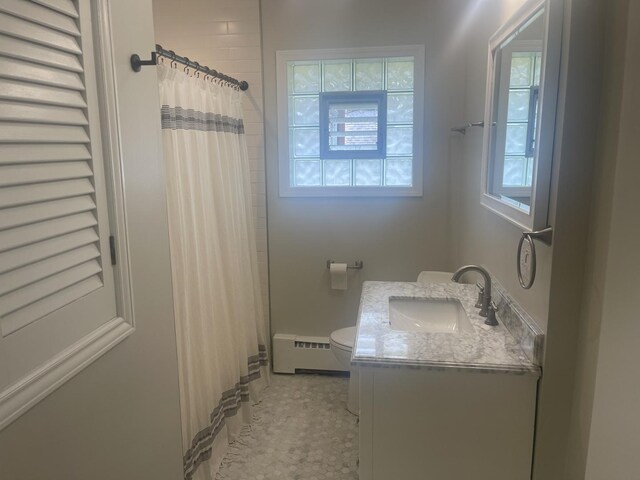 1530 S Greenwood Ave, Park Ridge, IL 60068 - bathroom featuring a baseboard radiator, vanity, and a shower with shower curtain