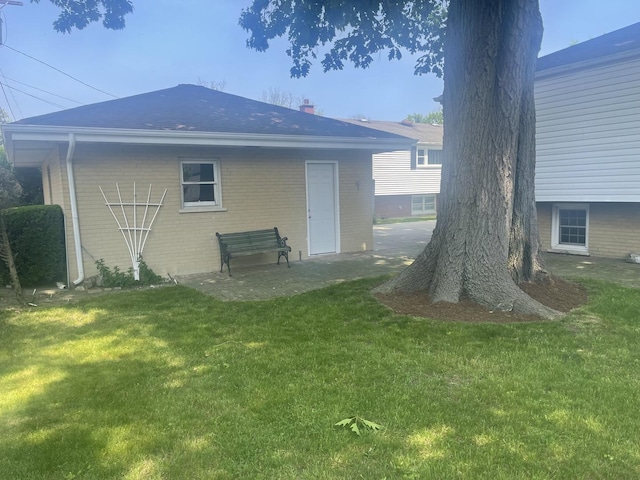 1530 S Greenwood Ave, Park Ridge, IL 60068 - rear view of property with brick siding, a yard, and a chimney