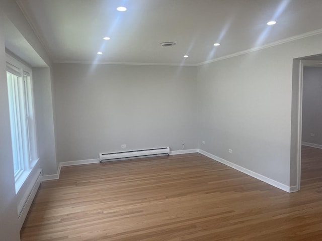 1530 S Greenwood Ave, Park Ridge, IL 60068 - spare room featuring a baseboard radiator, baseboard heating, wood finished floors, recessed lighting, and crown molding