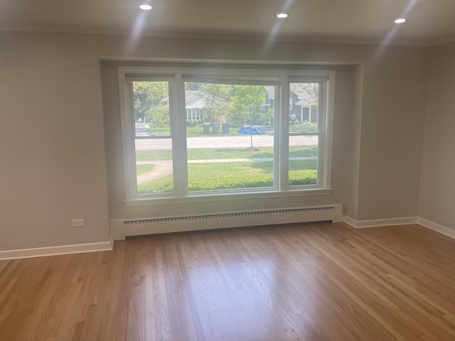 1530 S Greenwood Ave, Park Ridge, IL 60068 - empty room with a baseboard heating unit, healthy amount of natural light, light wood finished floors, and recessed lighting