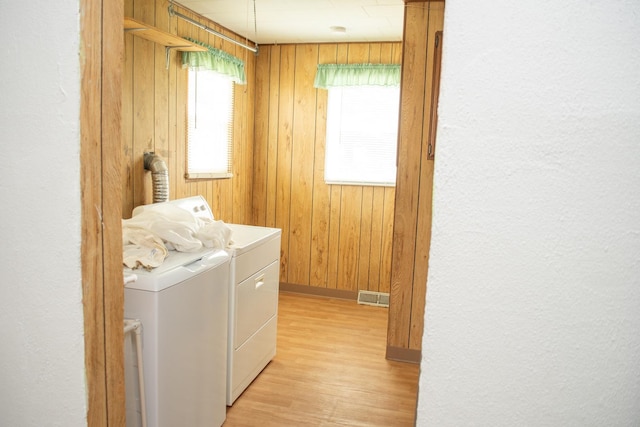 108 N Grove St, Harmon, IL 61042 - laundry area featuring washing machine and clothes dryer, light wood finished floors, and wooden walls
