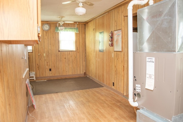 108 N Grove St, Harmon, IL 61042 - foyer entrance with wood finished floors, wooden walls, ceiling fan, and heating unit