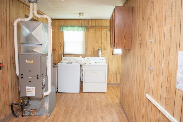 108 N Grove St, Harmon, IL 61042 - laundry room with wood walls, wood finished floors, heating unit, and washing machine and dryer