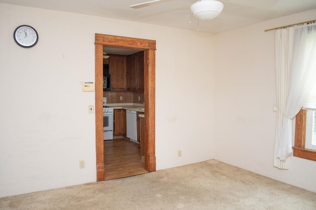 108 N Grove St, Harmon, IL 61042 - empty room with carpet flooring and ceiling fan