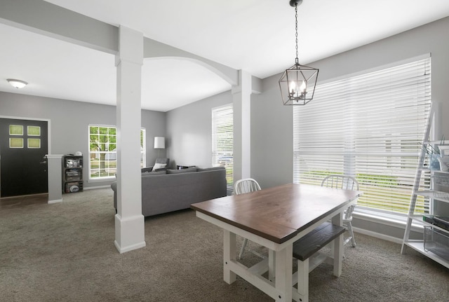 10628 Great Plaines Dr, Huntley, IL 60142 - dining room with carpet floors, arched walkways, and a chandelier