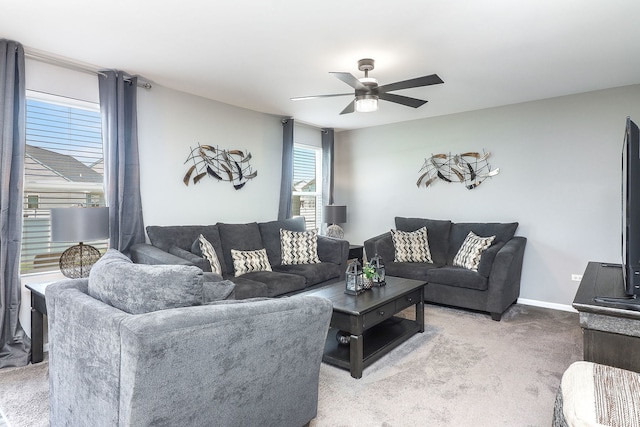 1307 Colaric Dr, Joliet, IL 60431 - living area featuring light colored carpet, ceiling fan, and plenty of natural light