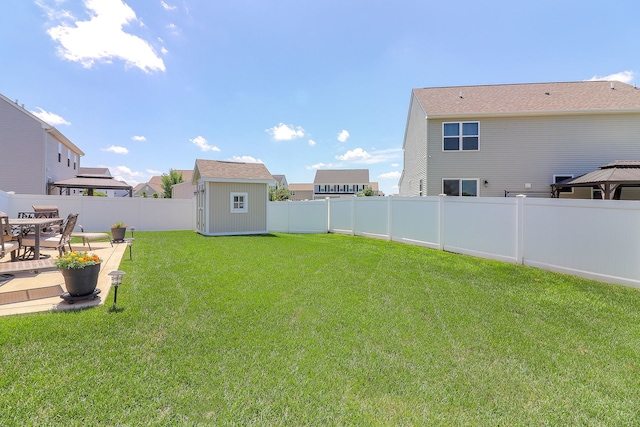 1307 Colaric Dr, Joliet, IL 60431 - fenced backyard featuring a storage unit and a patio area