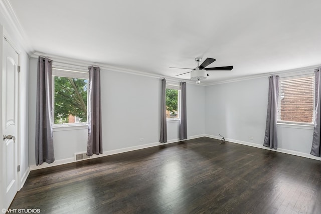 1628 Kenilworth Ave, Berwyn, IL 60402 - empty room featuring plenty of natural light, a ceiling fan, dark wood-style flooring, and ornamental molding