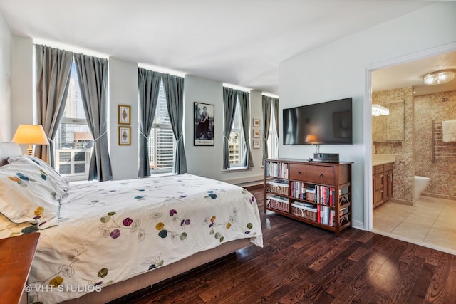 25 E Superior St Unit 2402, Chicago, IL 60611 - bedroom featuring wood finished floors and connected bathroom