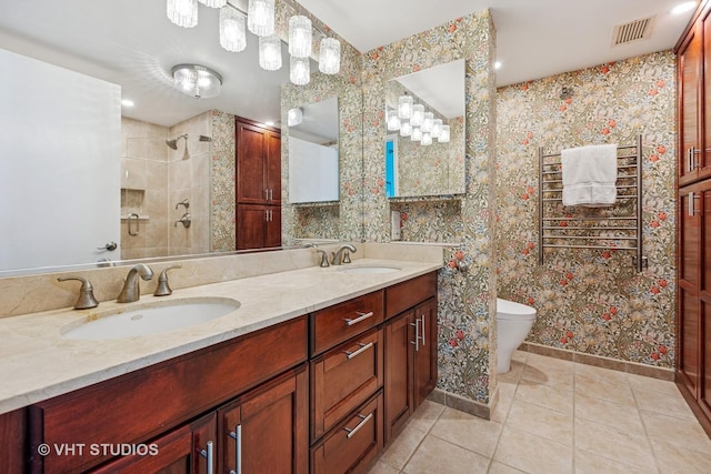 25 E Superior St Unit 2402, Chicago, IL 60611 - bathroom featuring tile patterned floors, double vanity, and tiled shower