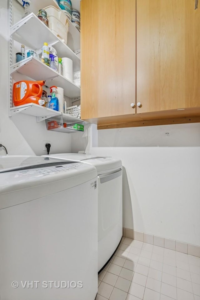 25 E Superior St Unit 2402, Chicago, IL 60611 - washroom with cabinet space and independent washer and dryer
