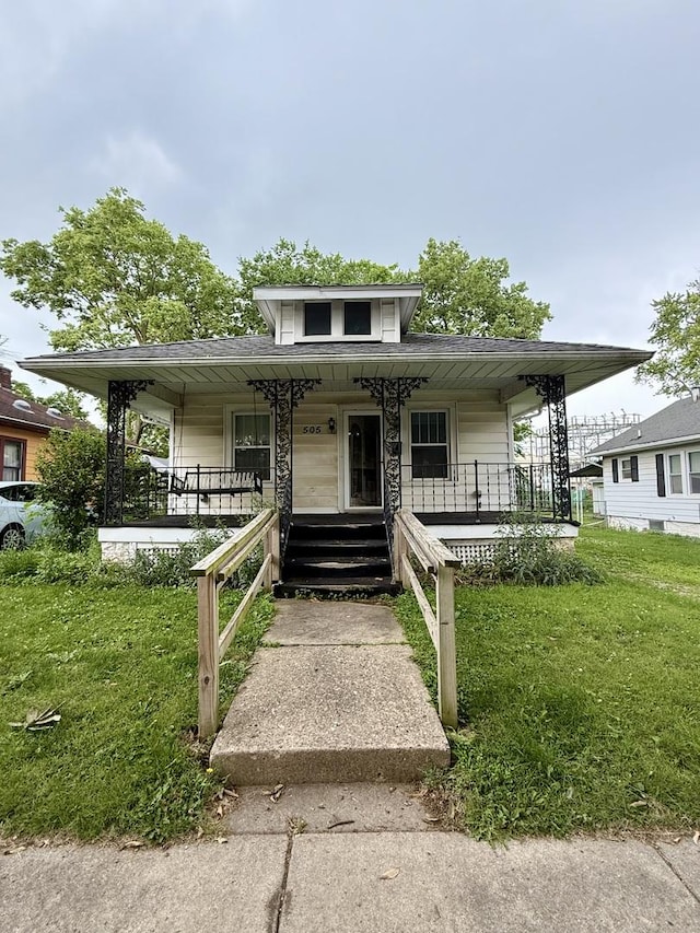 505 N Fair St, Champaign, IL 61821 - bungalow-style house featuring covered porch and a front lawn