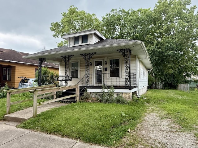 505 N Fair St, Champaign, IL 61821 - bungalow-style house featuring a porch and roof with shingles