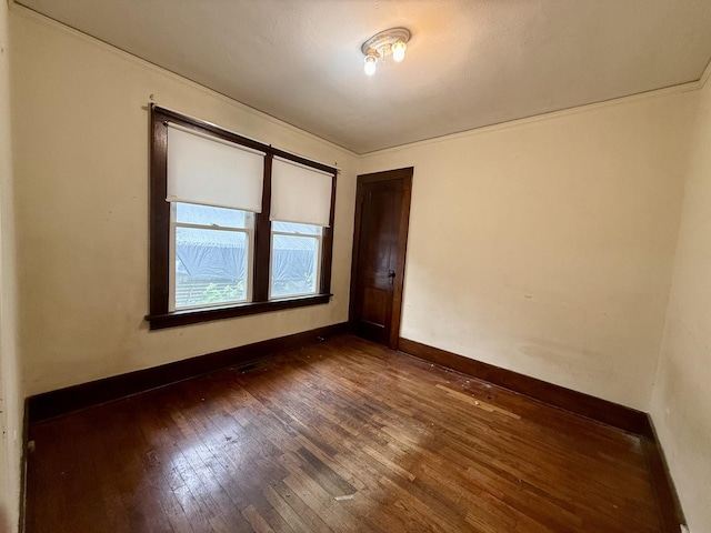 505 N Fair St, Champaign, IL 61821 - spare room with dark wood-type flooring and baseboards