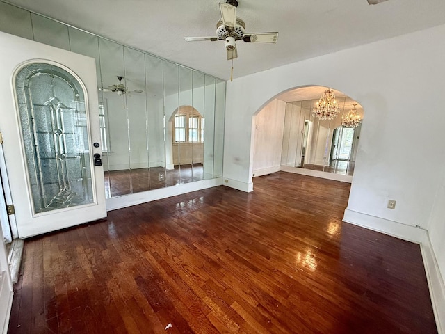 505 N Fair St, Champaign, IL 61821 - unfurnished room featuring hardwood / wood-style floors, a ceiling fan, arched walkways, and a chandelier