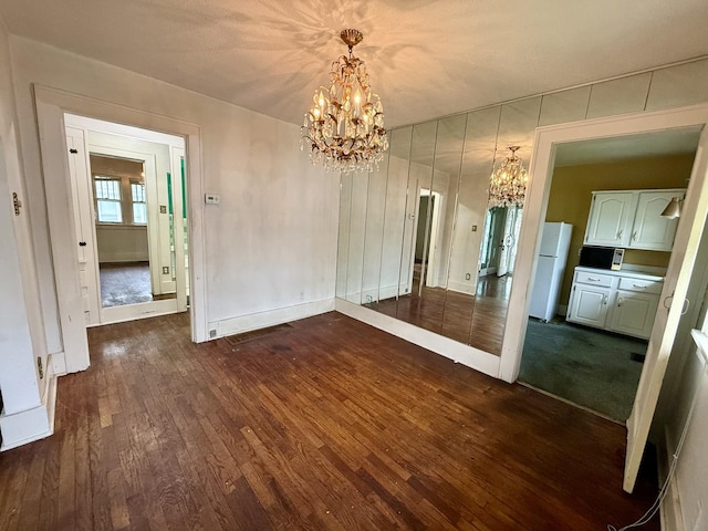 505 N Fair St, Champaign, IL 61821 - unfurnished dining area with a chandelier and dark wood-type flooring