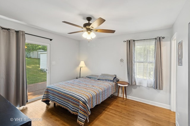 304 Pheasant Trl, Lake In The Hills, IL 60156 - bedroom with access to outside, wood finished floors, and ceiling fan