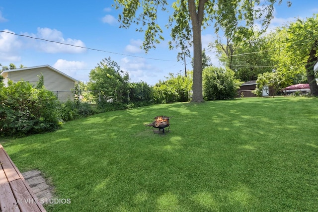 304 Pheasant Trl, Lake In The Hills, IL 60156 - view of yard featuring an outdoor fire pit