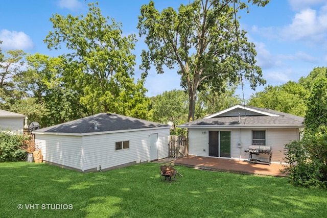 304 Pheasant Trl, Lake In The Hills, IL 60156 - back of property with a fire pit, a wooden deck, and a shingled roof