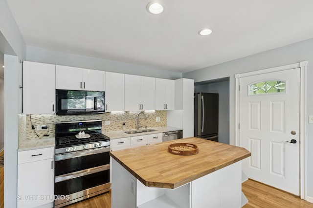 304 Pheasant Trl, Lake In The Hills, IL 60156 - kitchen with stainless steel appliances, wood counters, light wood-type flooring, decorative backsplash, and recessed lighting