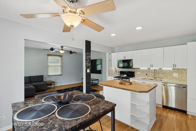 304 Pheasant Trl, Lake In The Hills, IL 60156 - kitchen featuring stainless steel appliances, wood counters, open shelves, light wood-style floors, and backsplash