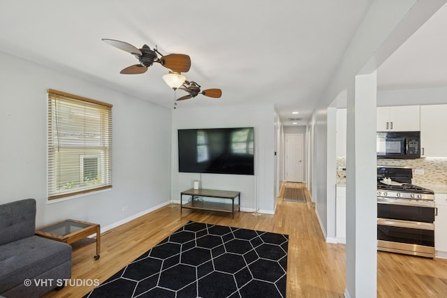 304 Pheasant Trl, Lake In The Hills, IL 60156 - living area featuring light wood-type flooring and a ceiling fan
