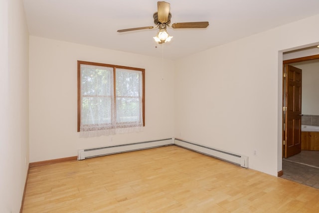 22998 E 2800 N Rd, Odell, IL 60460 - spare room with baseboard heating, wood finished floors, and a ceiling fan
