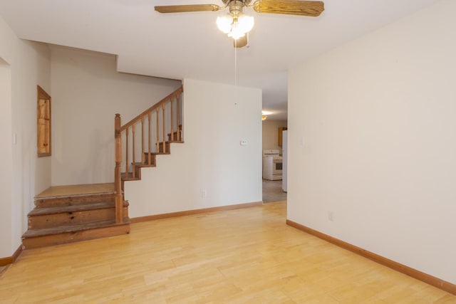 22998 E 2800 N Rd, Odell, IL 60460 - unfurnished room featuring stairway, a ceiling fan, and light wood-type flooring